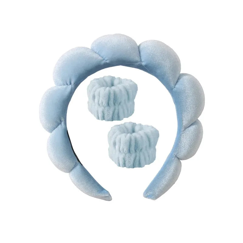 Light blue plush spa headband set with two matching wrist towels for face washing.