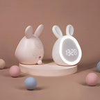 White and pink bunny-shaped kids alarm clocks with LED night lights and digital time