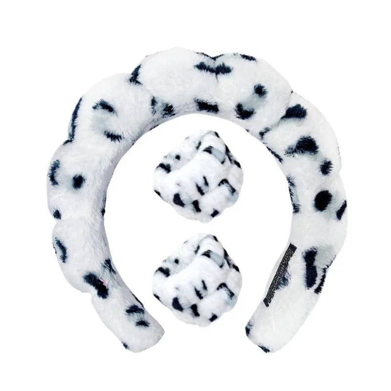 Dalmatian plush spa headband with matching wrist towels, dark spots on white.