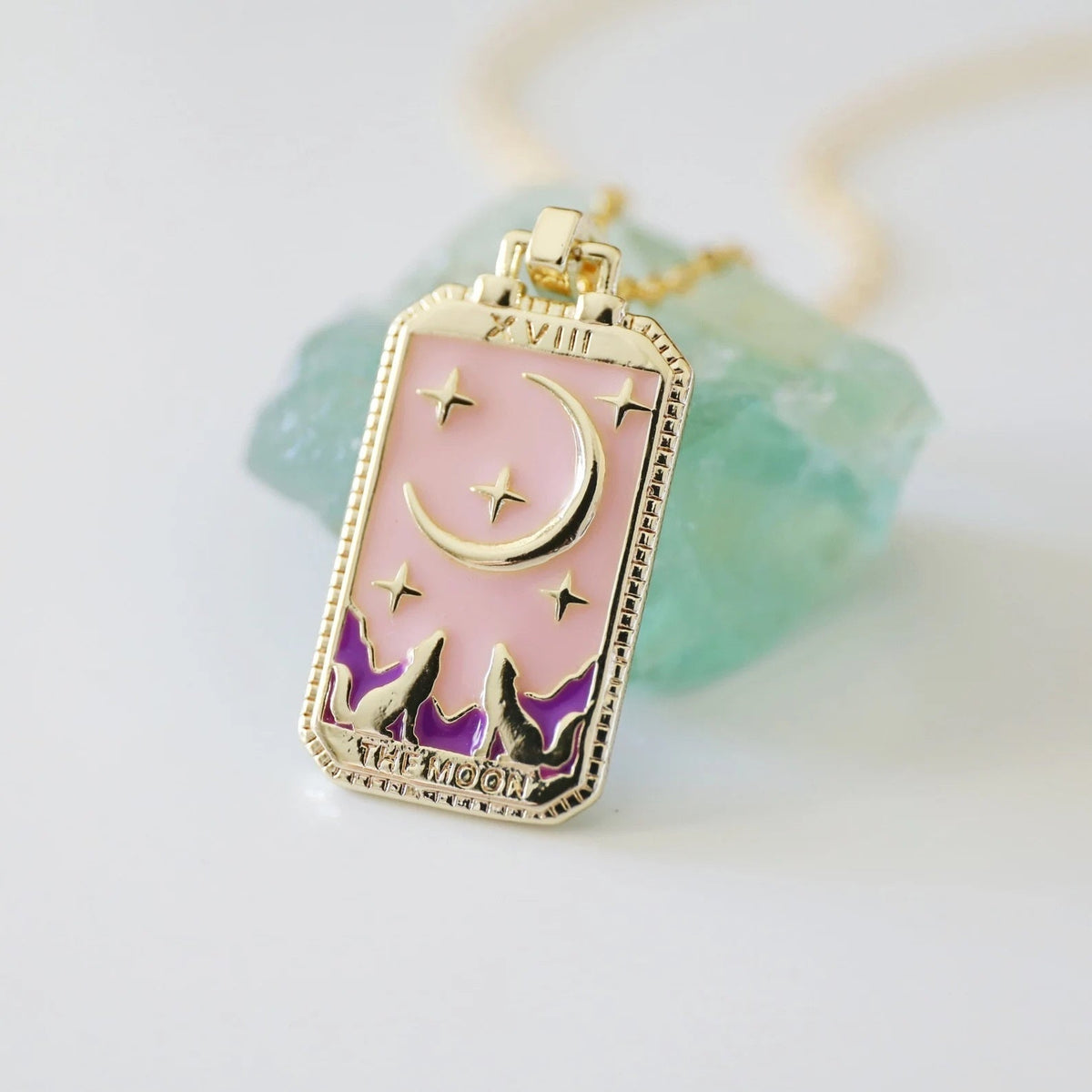 Gold-tone tarot card necklace with purple enamel crescent moon and star motifs, link chain