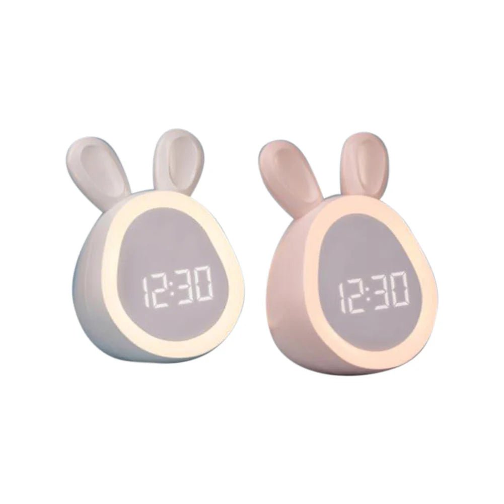 Two bunny-shaped kids alarm clocks: white and pink with LED night lights and time display