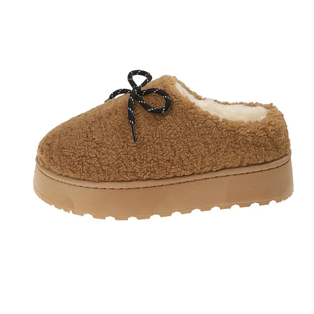 A brown sherpa fleece slipper with a tan platform sole and black laces, shown on a white background with a red dimension marker indicating a height of 4.5cm (1.