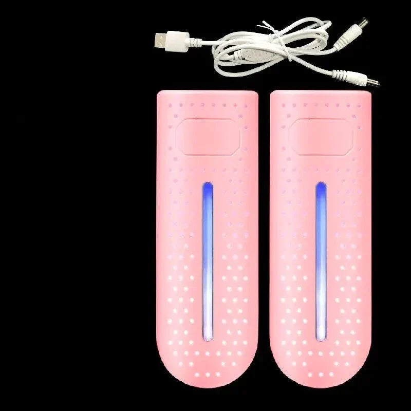 Portable shoe dryer with UV light, pink pair with blue lamp glow and power cables