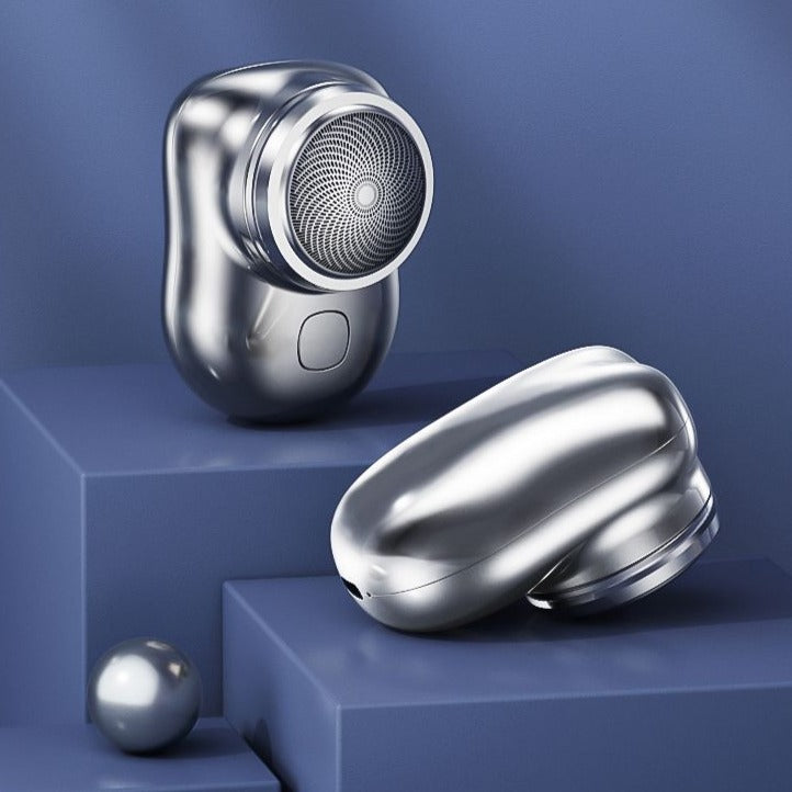 Mini electric shaver, chrome-finish silver body with round foil shaving head