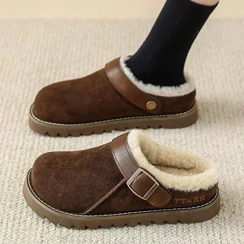 Dark brown fleece-lined mule clogs with adjustable buckle strap and tread sole