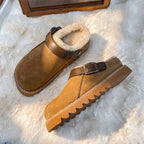 Brown suede fleece-lined clog mules with buckle strap and cushioned sole
