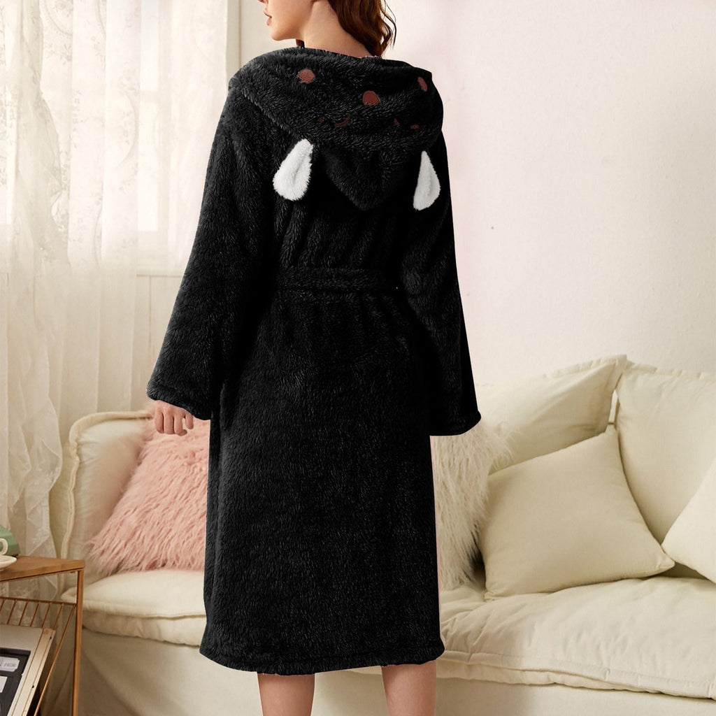 Black plush bathrobe with bunny-ears hood, white paw details, tied belt, long sleeves.
