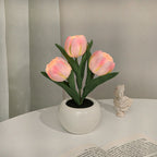 Pink tulip night light blooms in a white ceramic pot with soft warm LED glow
