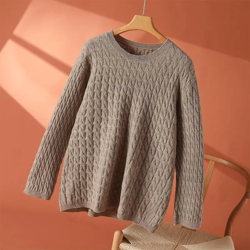 Gray textured long-sleeve sweater with crew neck and raised cable-knit texture