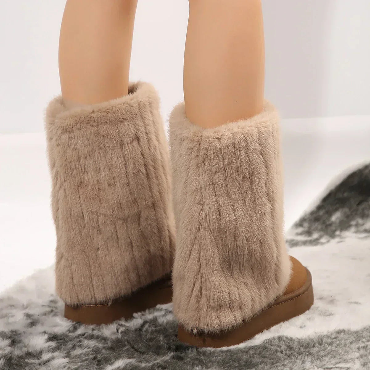 Tan knee-high platform lug boots with fluffy faux-fur ankle cuffs and chunky tread soles