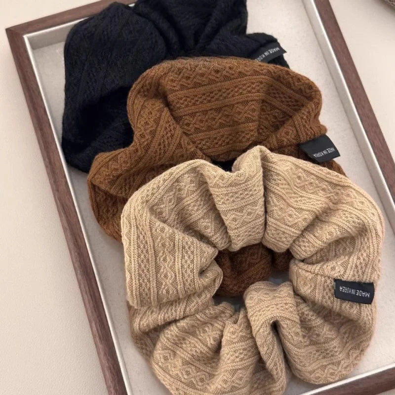 Brown knit oversized hair scrunchie with vintage pattern and fabric-covered elastic.