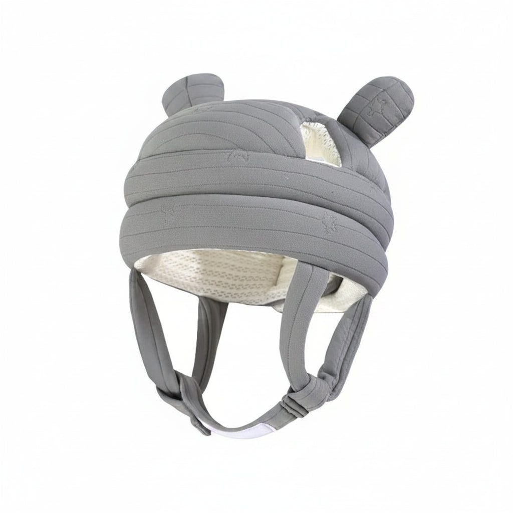 Gray helmet with ear-like features on a light blue background