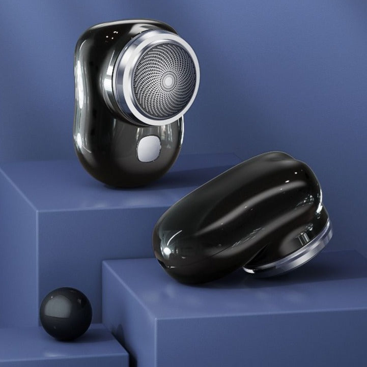 Mini electric shaver, black body with round foil shaving head
