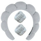 Gray plush spa headband set with two matching wrist towels for face washing.
