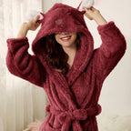 Plush hooded bathrobe in deep red with bunny ears and thick long sleeves, belt tied