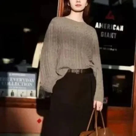 Beige textured long-sleeve sweater with crew neck and loose silhouette