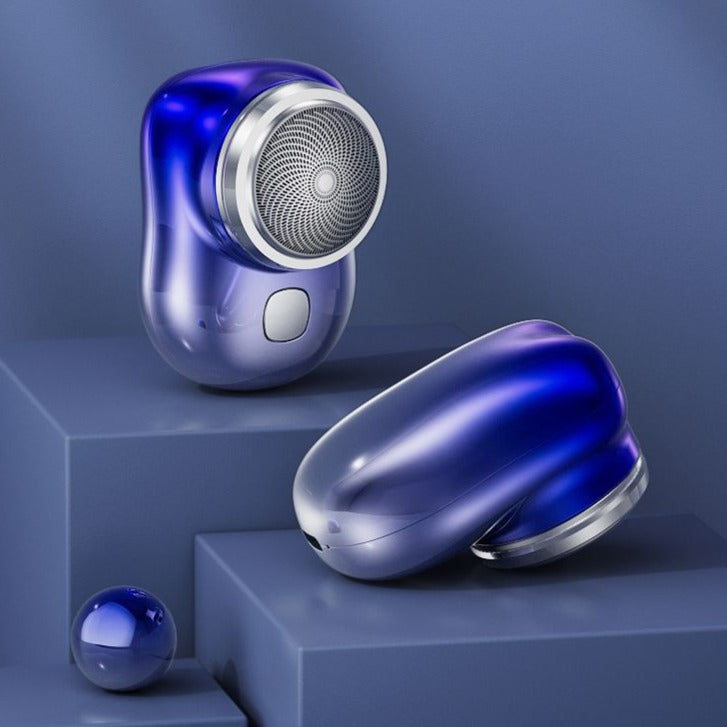 Mini electric shaver, blue metallic body with round foil shaving head