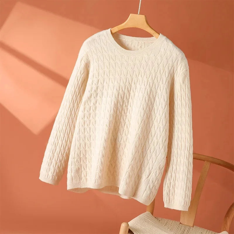 White textured long-sleeve sweater with crew neck and textured cable pattern