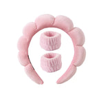 Light pink plush spa headband with two matching fuzzy wrist towels for face washing