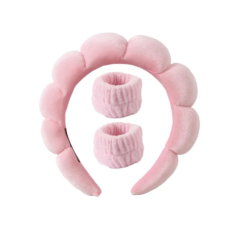 Light pink plush spa headband with two matching fuzzy wrist towels for face washing