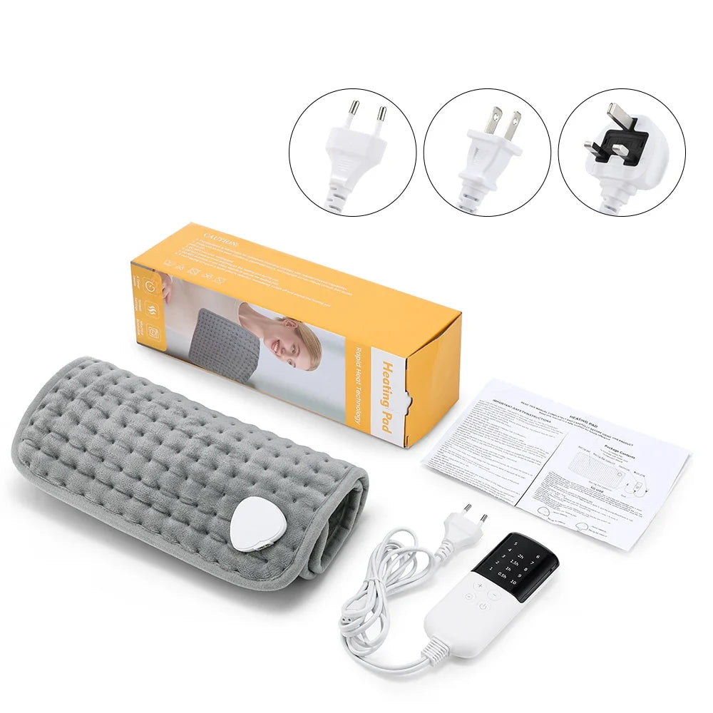 Gray electric heating pad with power cord, control box, and instruction papers