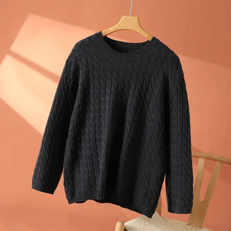 Black textured long-sleeve sweater with crew neck and raised knit pattern
