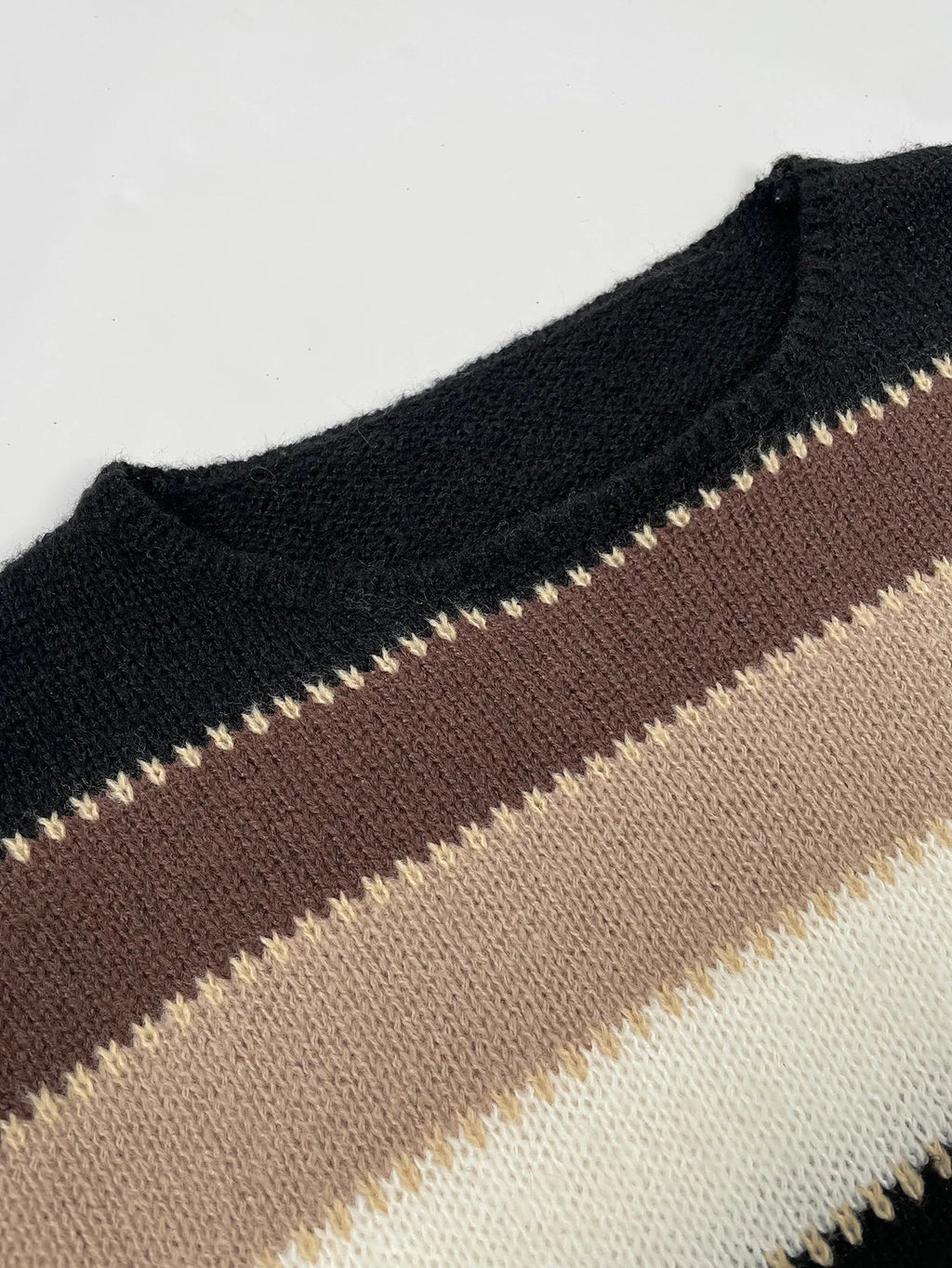 Striped women's sweater in brown, beige, and black knit with ribbed crew neck
