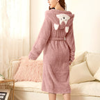 Pink plush hooded bathrobe with fox face on hood, long sleeves, belted waist