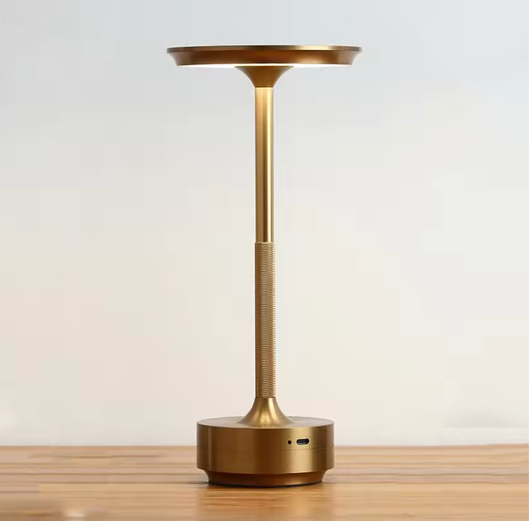 Champagne gold cordless LED table lamp with round base and touch control