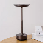 Brushed bronze cordless LED table lamp with textured stem and round top