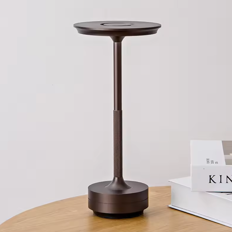 Brushed bronze cordless LED table lamp with textured stem and round top