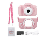 Pink kids digital camera with wrist strap and included cable and manual