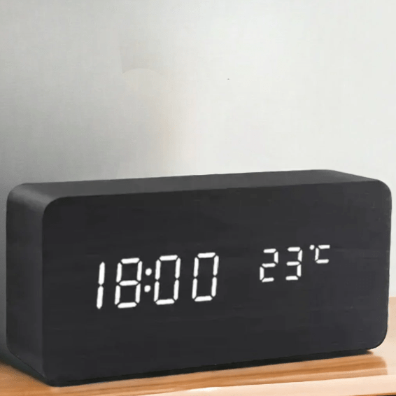 Matte black LED digital clock with white time and temperature digits on base