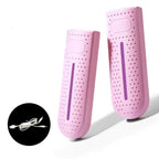 Portable shoe dryer with UV light, pink pair with purple glow and power cords