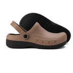 Tan and black non-slip chef clogs with heel strap and textured outsole