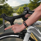 Black smartwatch fitness tracker on a person’s wrist while riding a bike