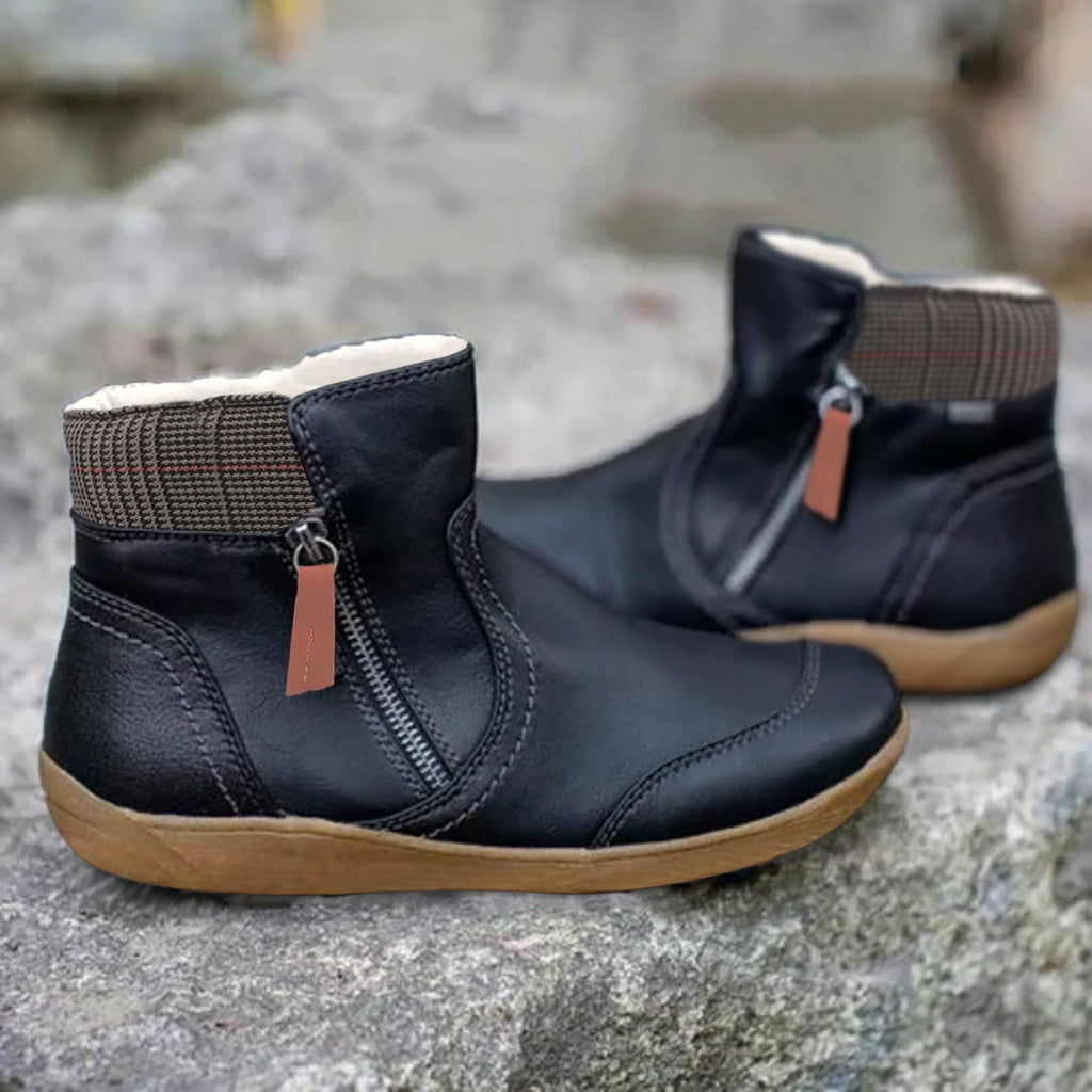 Women’s ankle boots in dark navy/black, side zipper, tan non-slip tread sole
