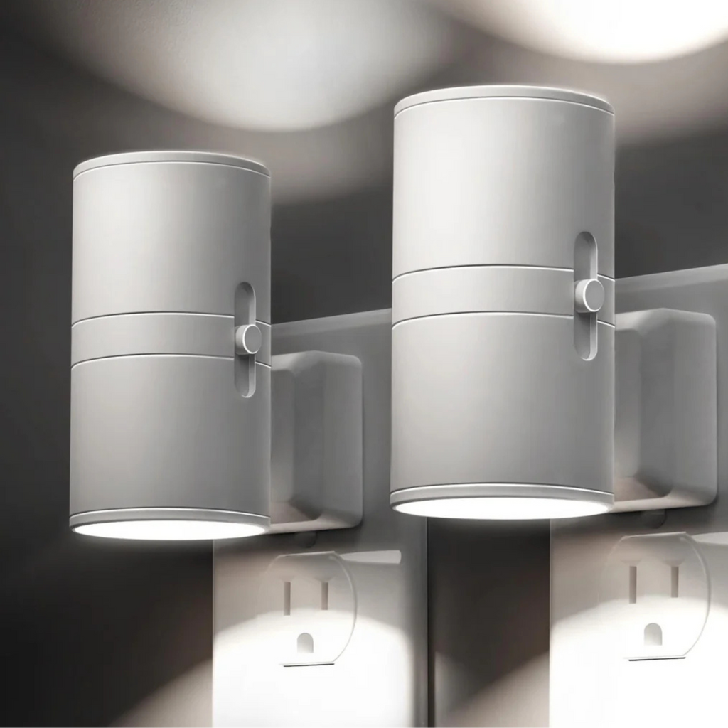 Pair of white cylindrical LED night lights with side switches, wall-mounted