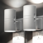 Pair of white cylindrical LED night lights with side switches, wall-mounted