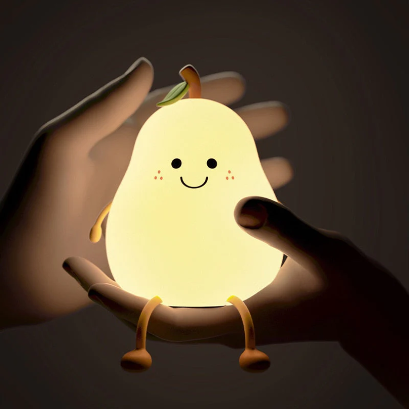 Pear-shaped kids night light with smiling face, green leaf, and glowing light