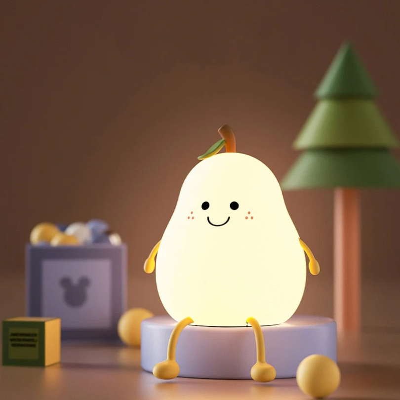 Glowing pear-shaped night light with smiling face, green leaf, on white base