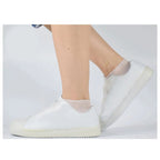 White reusable waterproof shoe covers with elastic ankle and textured zigzag tread