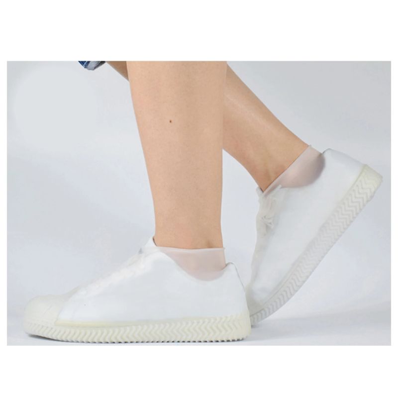 White reusable waterproof shoe covers with elastic ankle and textured zigzag tread