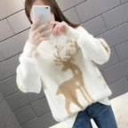 Women’s white knit crewneck Christmas sweater with tan reindeer and snowflake pattern