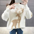 Women’s white knit crewneck Christmas sweater with tan reindeer and branch motif