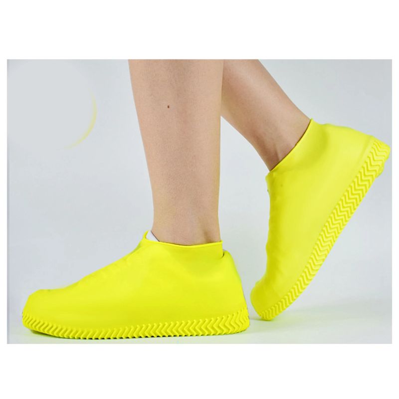 Yellow reusable waterproof shoe covers with elastic ankle and textured zigzag tread