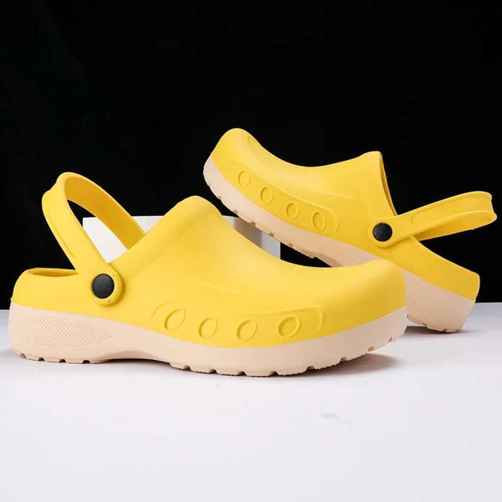 Yellow non-slip chef clogs with heel strap and treaded outsole