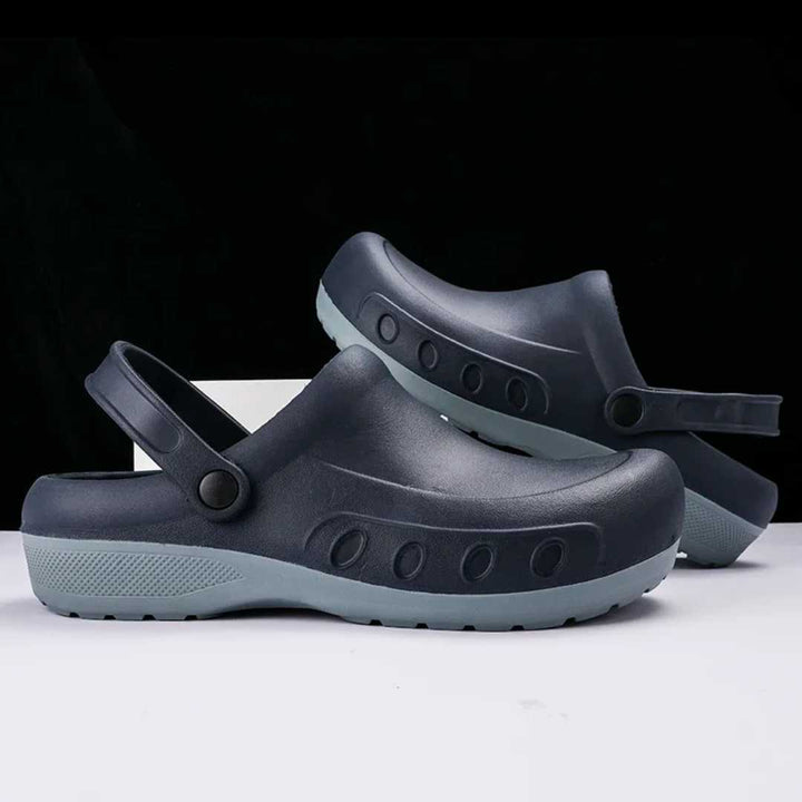 Gray non-slip chef clogs with heel strap and treaded outsole