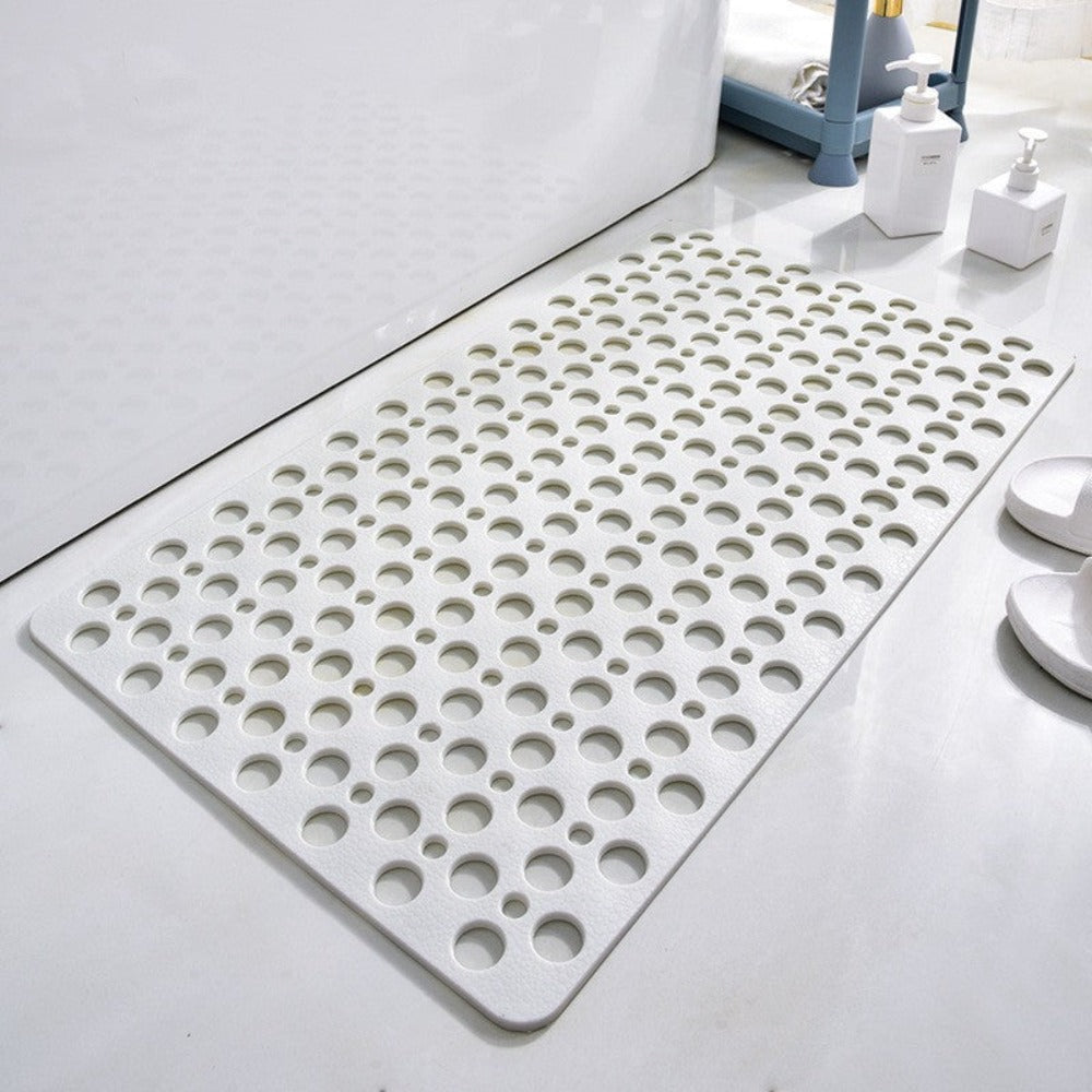 White non-slip shower mat with circular drainage holes and textured anti-slip grip.