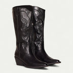 Women's black pointed-toe boots with decorative stitch details and stacked heel